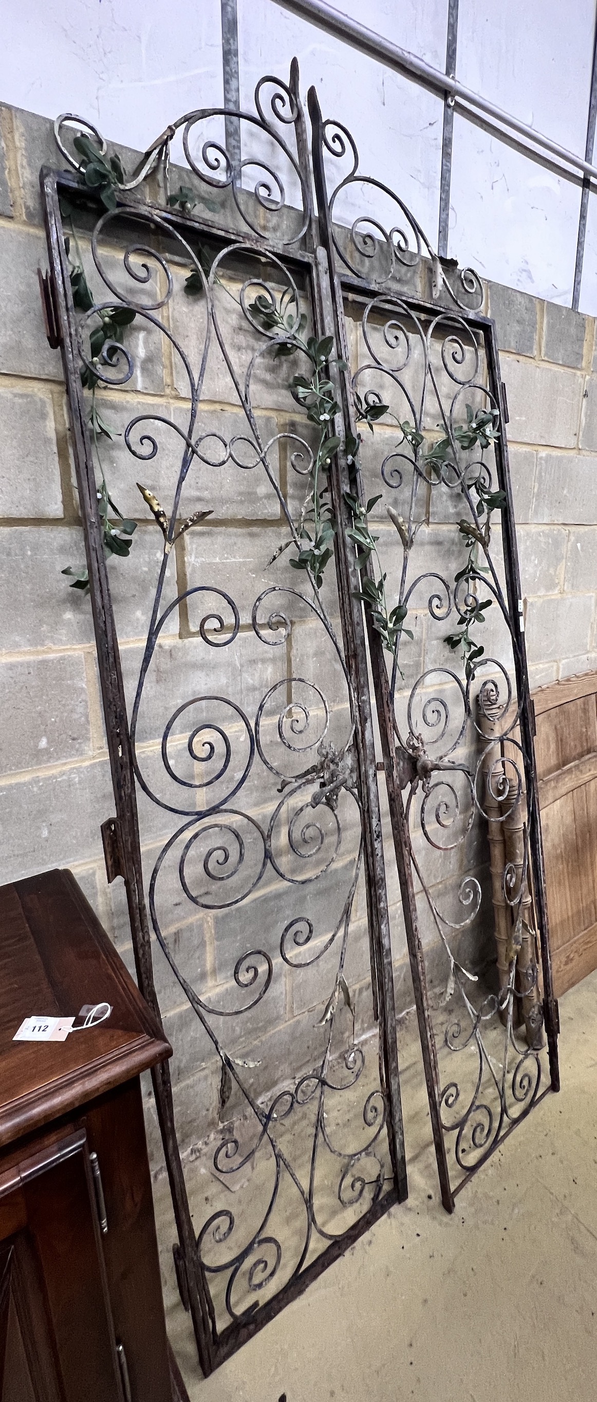 A pair of vintage French wrought iron gates, width 110cm, height 250cm